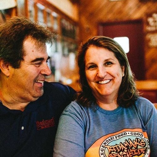 The owners, Chuck and Linda Maroney, share a smile at Redamak's in New Buffalo, Michigan.