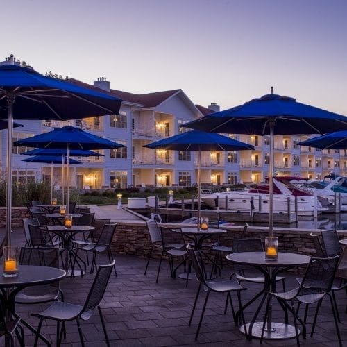 Waterfront patio seating of Bentwood Tavern at Marina Grand Resort in New Buffalo, Michigan.at Marina Grand Resort in New Buffalo, Michigan.