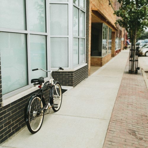 A bike parked on the main street exterior of Skyway wine country vacation rental in Baroda, Michigan.