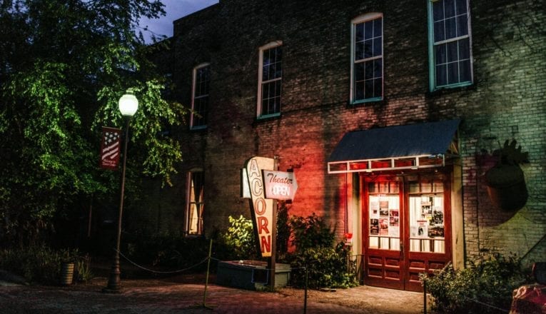 A nighttime view of The Acorn's entrance in Three Oaks, Michigan.