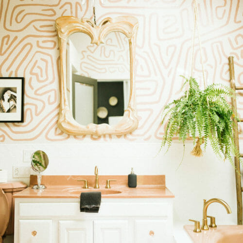 Graphic painted walls and glamorous accents in the bathroom at Flamingo Ranch in Lakeside, Michigan.