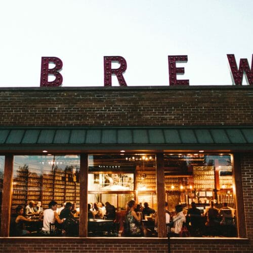 Greenbush Brewing's brick exterior with large windows and letters that spell 'brewery' on the roof.