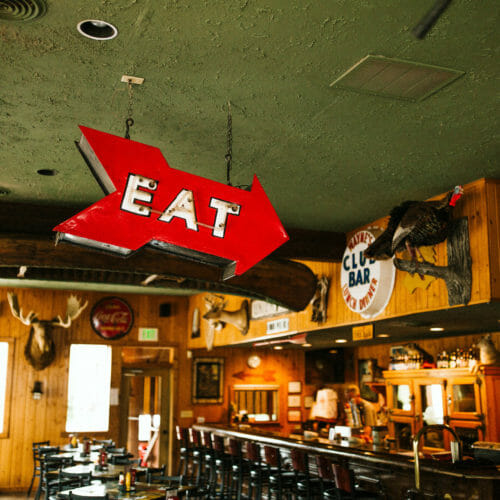 A lighted EAT sign at Red Arrow Roadhouse in Union Pier, Michigan.