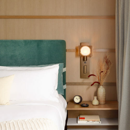 Harbor Grand Hotel Headboard with Sconce and Wood Wall