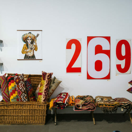 Alapash Interior Image of Vintage Rugs and Signs