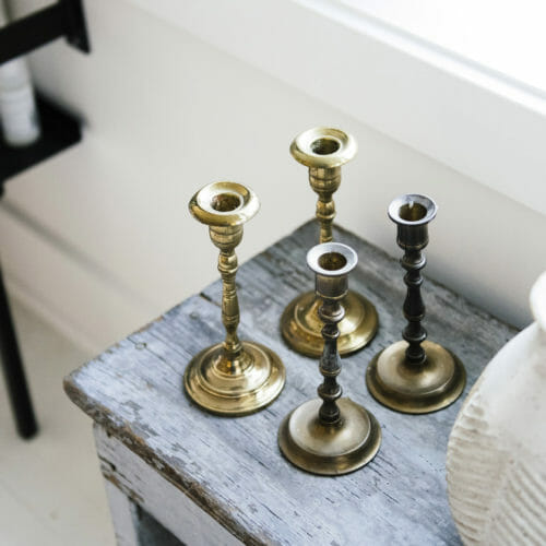 Brass candlesticks and a clay pot at Sojourn in Sawyer, Michigan.