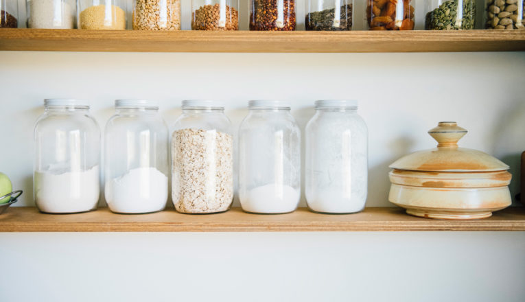 Neatly arranged glass jars of provisions in the kitchen of chef Abra Berens.