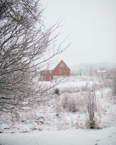 A snowy rural landscape frames a red barn in Galien, Michigan.