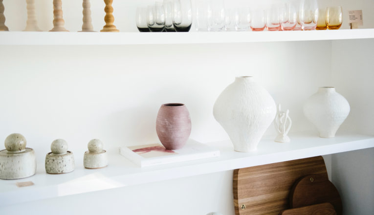 Soft white, pink, and amber ceramics and glassware at Sojourn in Sawyer, Michigan.