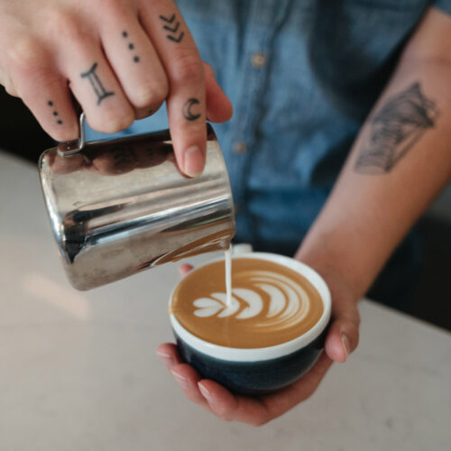 An artful latte being poured at Gather in Harbert, Michigan.