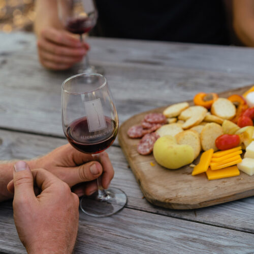A picnic of cheese, charcuterie, and wine at Hickory Creek Winery in Buchanan, Michigan.
