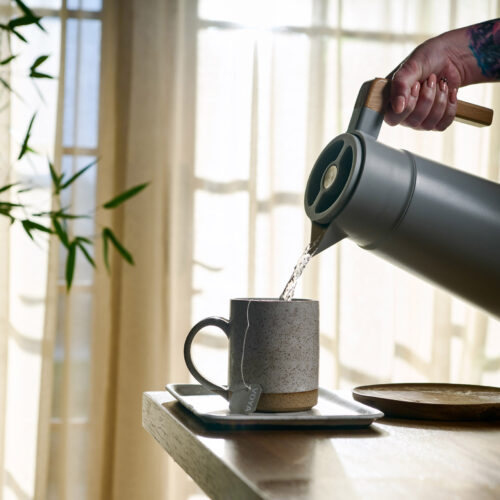 Pouring a cup of tea into a ceramic mug at Foundation Spa in New Buffalo, Michigan.