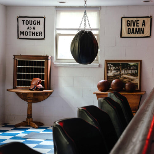 View of a retro bar and boxing equipment at The Neighborhood Hotel in New Buffalo, Michigan.