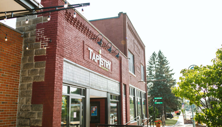 The red brick facade of Tapestry Brewing in Bridgman, Michigan.