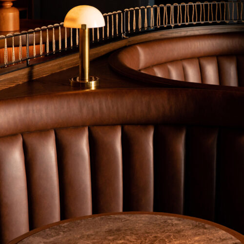 Cozy leather upholstered seating at Bentwood Tavern in New Buffalo, Michigan.