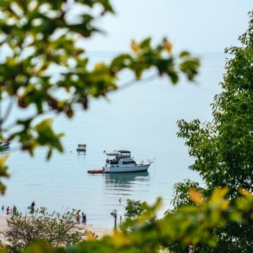 A boat leisurely passing by Maker’s Trail Festival in Bridgman, Michigan.