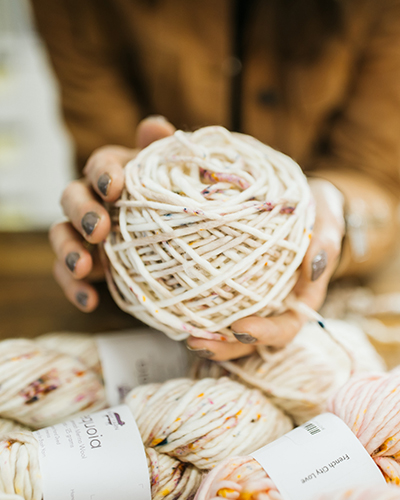 Suzanna Bierwirth holds a ball of yarn