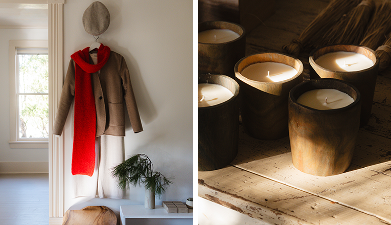 A knit outfits with a red scarf hangs on the wall next to an image of candles inside AP Shop in Lakeside, Michigan