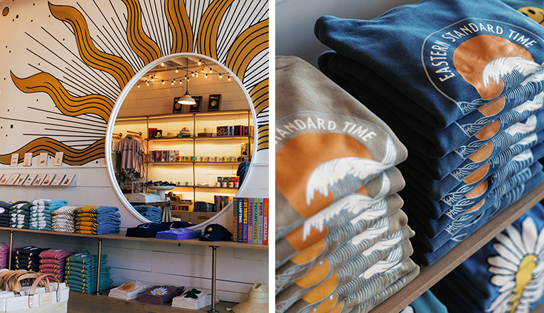 A sun mirror next to a stack of sweatshirts inside Eastern Standard Time, a shop in New Buffalo, Michigan
