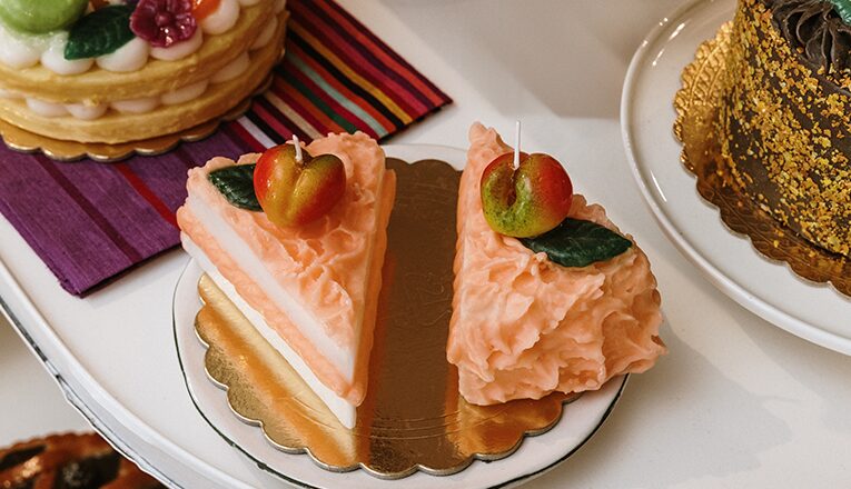 A trompe l'oeil candle of two slices of cake in Lakeside Goods in New Buffalo, Michigan