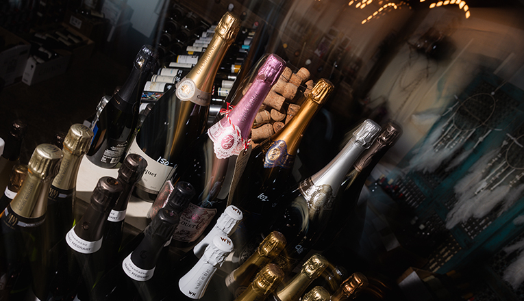 A motion blurred images of stacks of champagne bottles at P&E Bottle Shop in Three Oaks, Michigan