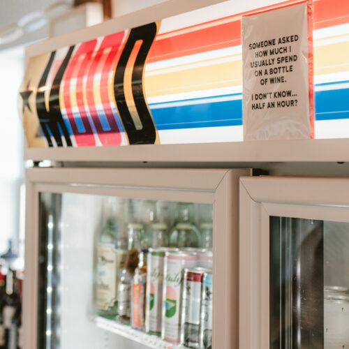 A sign above the coolers at P&E Bottle Shop in Three Oaks, Michigan