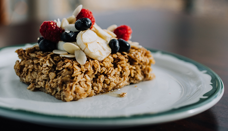 A granola bar topped with berries, shaved almonds, and bananas at Ray & Al's Lunchroom in Galien, Michigan