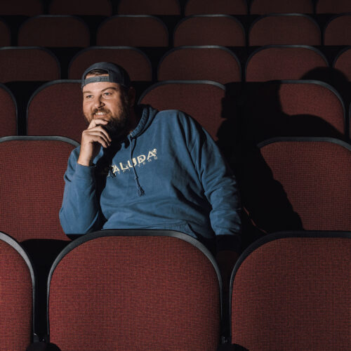 A portrait of Zach Hackett, proprietor of Vickers Theatre in Three Oaks Michigan