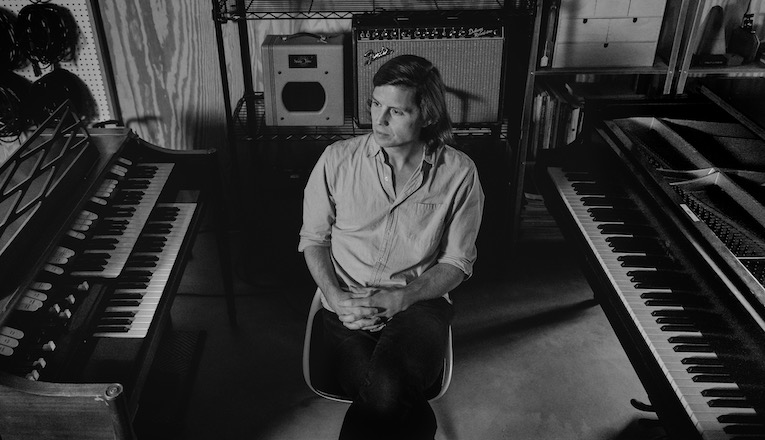 Musician/composer Erik Hall sits among pianos and keyboards in his home studio in Galien, Michigan.
