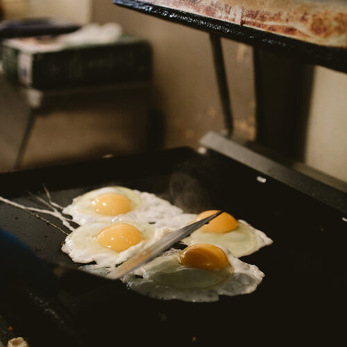 Eggs sizzling on the griddle at David's Deli in New Buffalo, Michigan