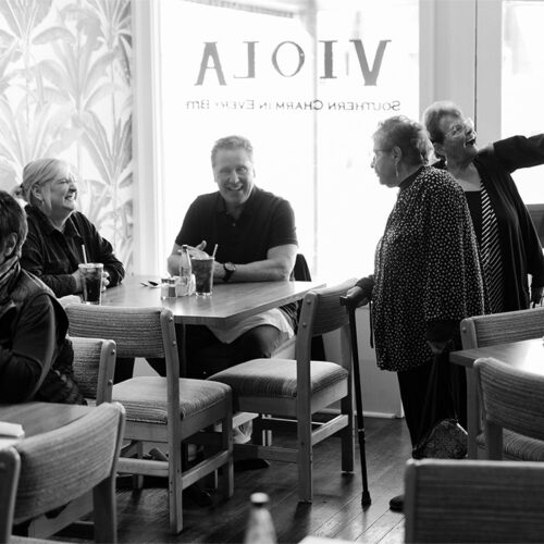 Owners of Viola Cafe greet regulars at Viola Cafe in Three Oaks, Michigan.