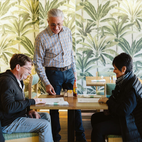 Owner, Anthony Bellon greets regular diners at Viola Cafe in Three Oaks, Michigan.
