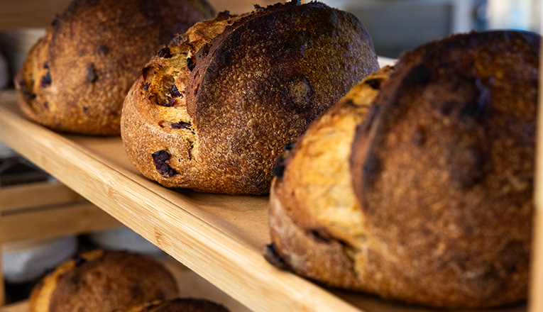 Freshly baked sourdough stocked on shelves at Farmette in New Buffalo, Michigan