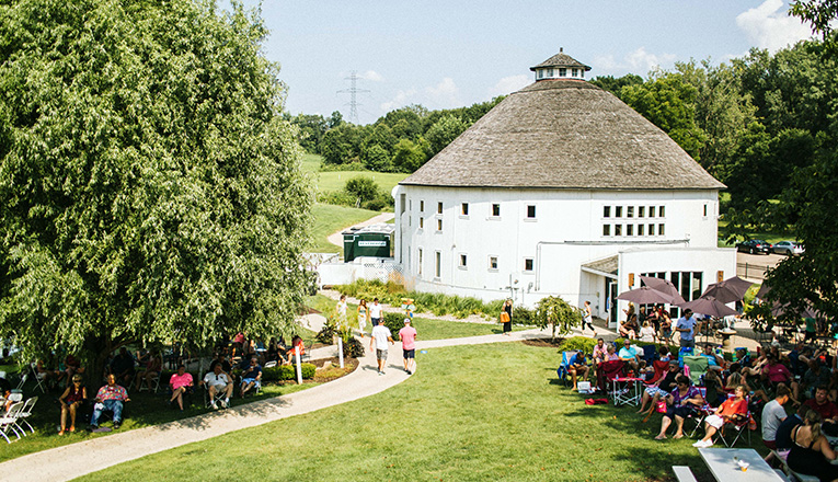 A lawn full of concert-goers at Round Barn Winery in Baroda, Michigan