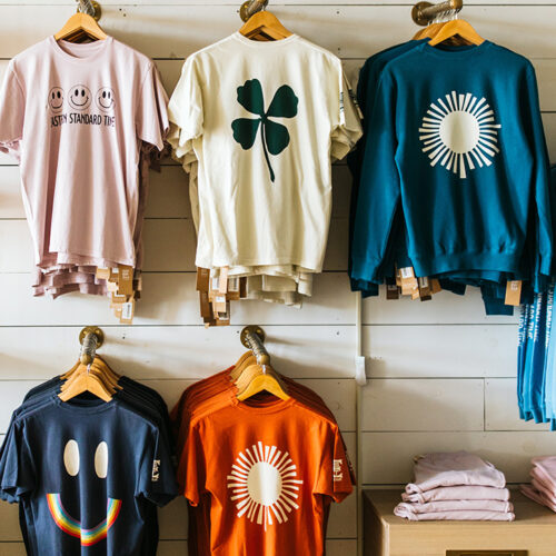 Graphic tees hang on the wall at Eastern Standard Time in New Buffalo, Michigan