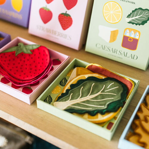 Caesar salad and strawberry coasters are on display at Eastern Standard Time in New Buffalo, Michigan