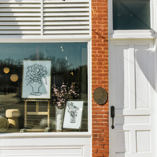 The storefront with a painting in the window at Lakeside Goods in New Buffalo, Michigan