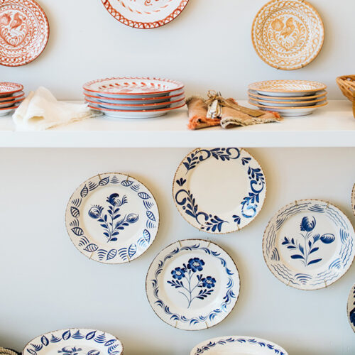 Blue, red, and gold painted plates at Lakeside Goods in New Buffalo, Michigan