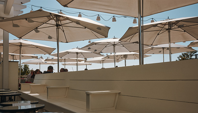 White umbrellas on the outdoor rooftop of Stray Dog in New Buffalo, Michigan