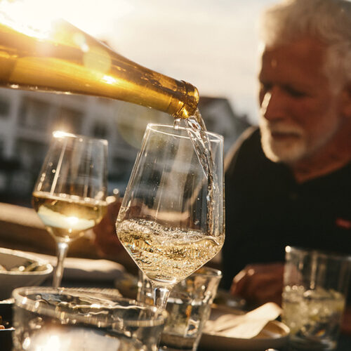 White wine is poured into a glass outside at Bentwood Tavern in New Buffalo, Michigan
